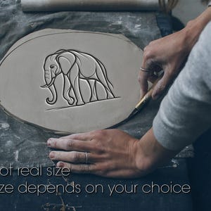 May include: A light gray clay piece with an elephant design being carved. The elephant is depicted in a linear style. The text "Not real size" and "Size depends on your choice" is at the bottom of the image.