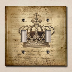 May include: A light switch cover with a vintage design featuring a gold crown on a parchment background with handwritten text. The text reads "Anno Circumdatio", "Providentia Item", "In Sum", "Om", "Admirari", "Et", "Ensis", "Au", "In", "De", "Om", "Super", "Ex", "In", "Sound", "Sound", "Anno", "Omnis", "Et", "The", "In", "Affirma", "Matthaeus", "In", "Cebit", "Et", "Omnis", "The", "Thos".