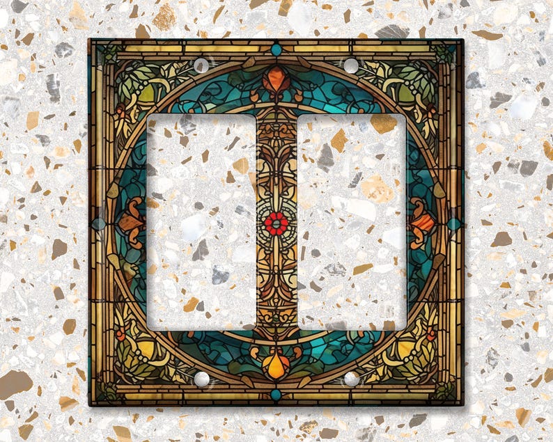 May include: Double light switch cover with a stained glass design featuring a blue, green, and gold color scheme with floral patterns.