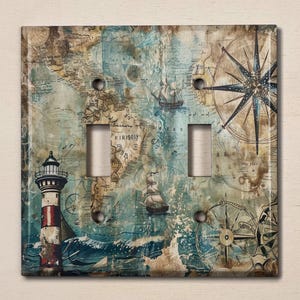 May include: A light switch cover with a nautical theme. The design features a lighthouse, a compass, a ship, and a map. The background is a blue and brown colour.