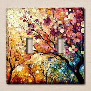 May include: A colorful abstract art design featuring a tree with pink, purple, and blue flowers. The background is a mix of yellow, orange, and green colors. This design is perfect for a light switch cover.