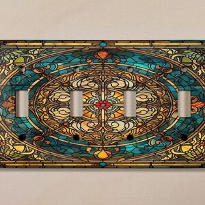 May include: A stained glass design light switch cover with a blue, green, yellow, and brown color scheme. The design features a circular pattern with a floral motif.