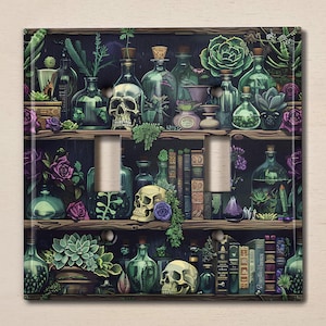 May include: A light switch cover featuring a whimsical illustration of a shelf filled with potion bottles, skulls, and books. The shelf is decorated with plants and flowers, creating a magical and enchanting atmosphere.