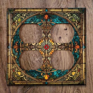 May include: A decorative outlet cover with a stained glass design featuring a circular pattern of blue, green, yellow, and red colors. The design includes intricate floral and geometric motifs.