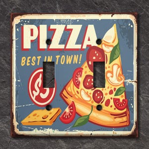 May include: A vintage-style light switch cover featuring a colorful illustration of a pizza slice with the text "Pizza Best in Town!"