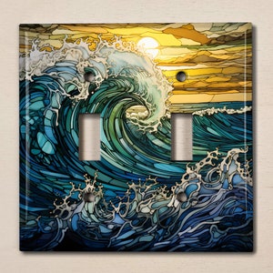 May include: A stained glass style light switch cover featuring a blue and green wave crashing against a yellow sunset background.