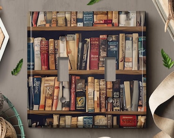 May include: A light switch cover featuring a bookshelf design with a variety of colourful books. The books are arranged on shelves with a dark wood finish. The switch cover is made of durable plastic and is easy to install.