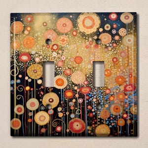 May include: A light switch cover with a colorful abstract design featuring a field of flowers with red, orange, yellow, and blue colors on a black background.