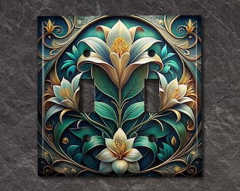 May include: A decorative light switch cover featuring a stylized floral design with white lilies, gold accents, and teal green leaves on a dark blue background.