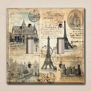 May include: A light switch cover with a vintage Parisian theme. The cover features images of the Eiffel Tower, a church, and other Parisian landmarks. The cover is decorated with vintage stamps and text.