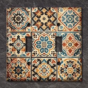 May include: A decorative light switch cover with a colorful tile pattern. The design features a variety of geometric shapes and floral motifs in shades of blue, brown, yellow, and white.
