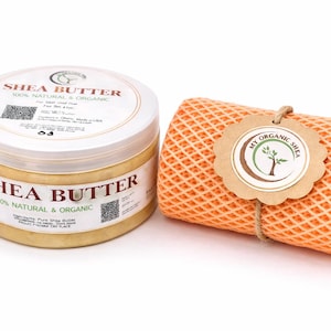 May include: A jar of shea butter with a white lid and a label that reads "Shea Butter 100% Natural & Organic." Next to it is an orange, waffle-textured item with a tag that says "My Organic Shea."
