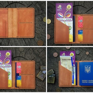 May include: A brown leather passport holder with multiple pockets for cards and tickets. The holder is open and shows a passport, credit cards, and a ticket for a soccer game between Netherlands and Germany.