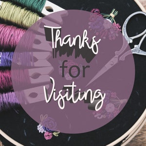 May include: A close-up of a purple circle with the text "Thanks for Visiting" in white. The circle is surrounded by embroidery floss, wooden clothespins, and a pair of scissors.