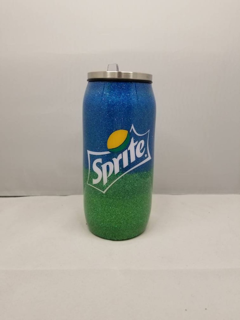 May include: A blue and green glitter tumbler with a Sprite logo. The tumbler has a stainless steel lid.