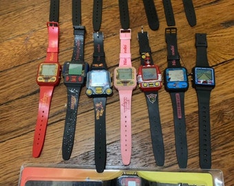 Giant lot of 15 working Nelsonic Nintendo game watch watches (Zelda,Mario 3, Mario World,, Donkey Kong,, Super Mario,Starfox pink Zelda,