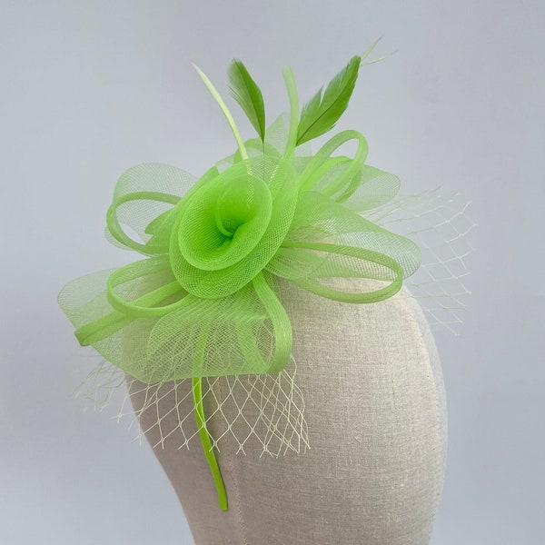 New bright green headband and clip bow shape netted flower and feather fascinator