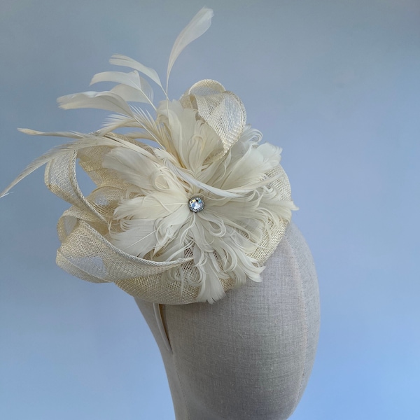 New cream sinamay fascinator with fancy feather diamanté flower, headband and clip