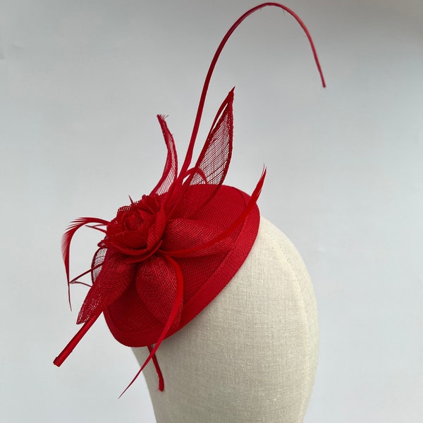 Red sinamay flower petal fascinator with added feathers on changeable headband or clip stripped quill