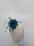 Teal sinamay flower clip fascinator and brooch with feathers