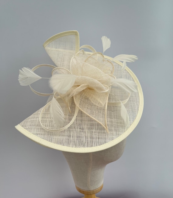 New cream headband and clip fascinator made from sinamay with feathers