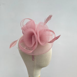 New blush pink headband and clip rounded mesh fascinator with mesh loops and flowers and added feathers