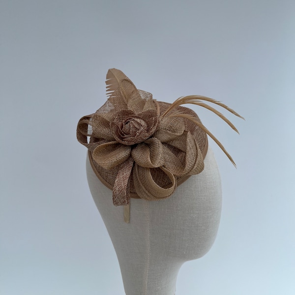 Dark Beige sinamay flower petal and loop fascinator with added feathers on changeable headband or clip with a feather quill