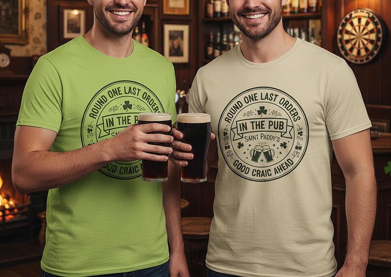 Kiwi Green and Sand Colors unisex crewneck tee with a white or light-colored vintage pub stamp graphic. The "Round One Last Orders" and "Good Craic Ahead" text pops against the green fabric, creating a monochromatic Irish look perfect for St. Paddy's Day parades and pub crawls.