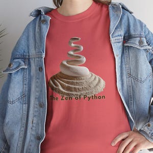 Coral silk t-shirt with a graceful, artistic Python Zen emblem. Empowering and unique graduation gift for female data analysts and computer science students Class of 2026.