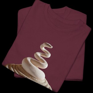 Maroon t-shirt with a graceful, artistic Python Zen emblem. Empowering and unique graduation gift for female data analysts and computer science students Class of 2026.
