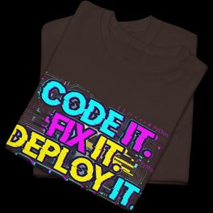 Chocolate t-shirt with electric neon cyan and magenta glitch text. High-contrast "Code It Fix It" design for Python developers and computer science students. Edgy hacker aesthetic.