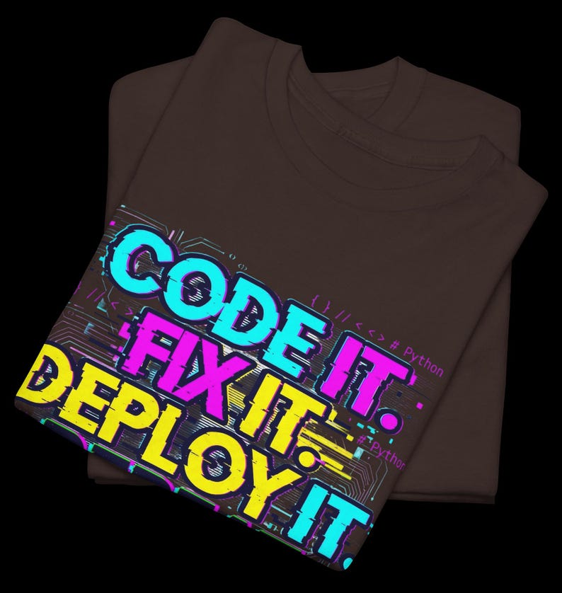 Chocolate t-shirt with electric neon cyan and magenta glitch text. High-contrast "Code It Fix It" design for Python developers and computer science students. Edgy hacker aesthetic.