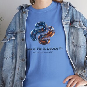 Carolina blue t-shirt with a sophisticated 3D Python emblem. Professional attire for backend developers and AI engineers. Perfect gift for work anniversaries in the tech industry.
