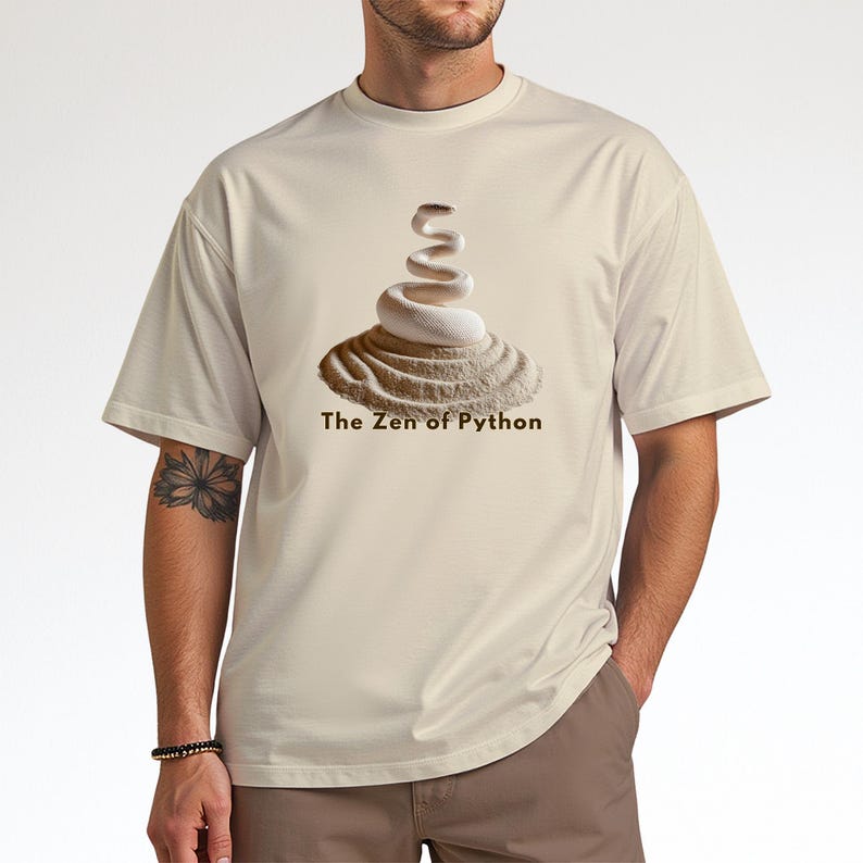 Natural beige t-shirt featuring a detailed white python snake in a serene Zen sand garden. "The Zen of Python" motto for developers. High-end, sophisticated STEM graphic.