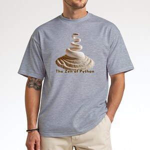 Sport grey t-shirt with an elegant minimalist print of a white coiled python on a raked sand garden. "The Zen of Python" text below. Aesthetic tech apparel for programmers and computer science grads.