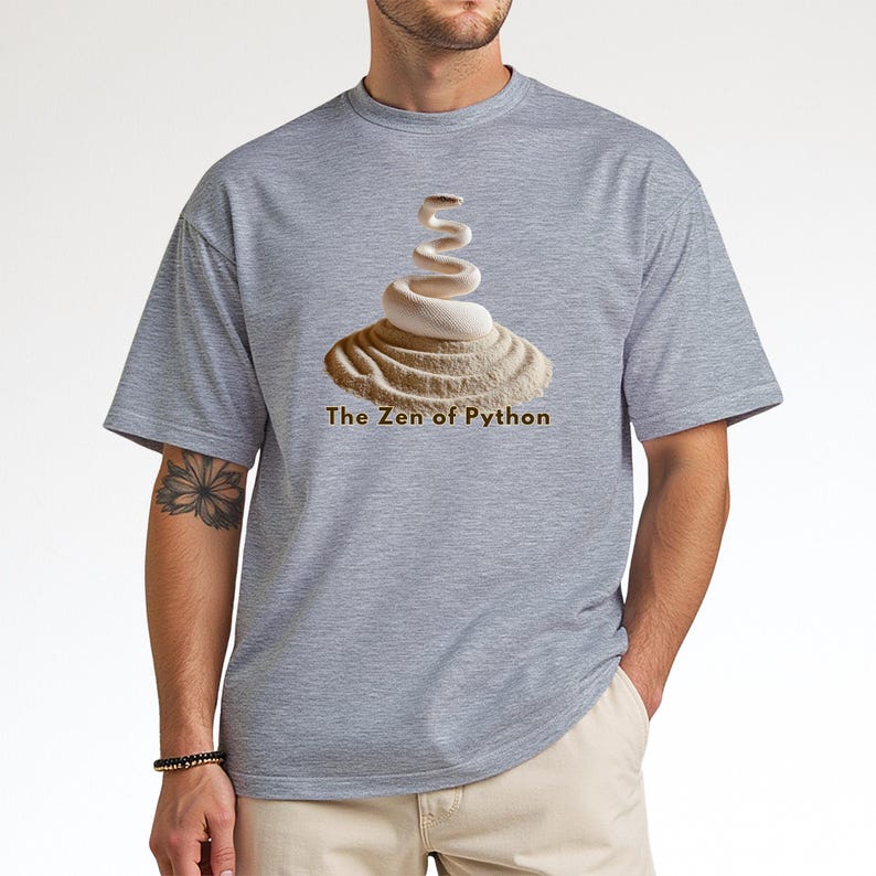 Sport grey t-shirt with an elegant minimalist print of a white coiled python on a raked sand garden. "The Zen of Python" text below. Aesthetic tech apparel for programmers and computer science grads.