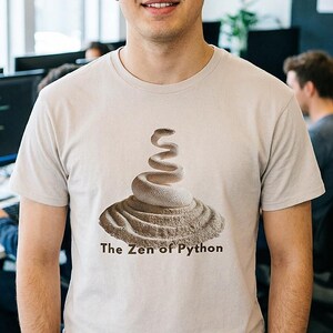 Ice grey t-shirt with an elegant minimalist print of a white coiled python on a raked sand garden. "The Zen of Python" text below. Aesthetic tech apparel for programmers and computer science grads.