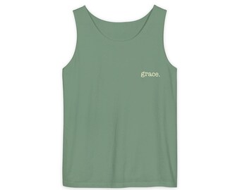 May include: Sage green tank top with the word "grace" printed in a small, white font on the upper chest. The sleeveless top has a scoop neckline and is made of a soft, lightweight material. A casual, everyday wear item.