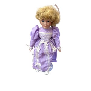 Vintage Porcelain Doll With Blonde Hair In Purple Lace Dress & Stand