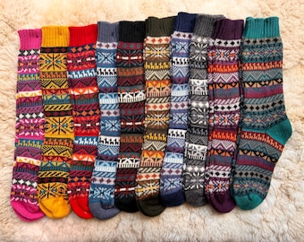 May include: Ten pairs of colorful patterned socks with a variety of colors and designs. The socks are made of a soft, knitted fabric and are perfect for keeping your feet warm in the winter.
