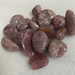 Purple rose quartz tumbles