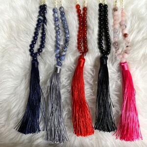 Beaded crystal necklace and faux pearl tassel necklace