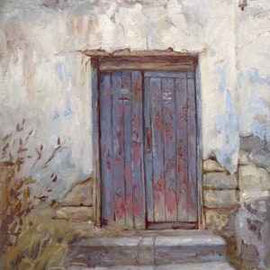 May include: A weathered wooden door with peeling blue paint, set into a crumbling white wall. The door is flanked by stone steps leading up to it, and there is a patch of green foliage in the foreground.