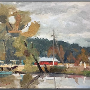 May include: A painting of a red building with a white roof on the edge of a lake. The building is surrounded by trees and there are boats docked in the water. The sky is cloudy and gray.