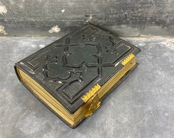 Photo album in leather and brass hinges, Neo-Gothic style, with photos inside, 19th century
