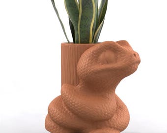 Maceta, macetero, portalápices o recipiente para dulces con forma de serpiente suculenta.