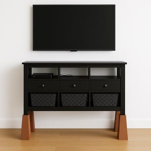 May include: A black TV stand with three drawers, three open compartments, and three woven baskets. The stand is elevated by four brown wooden blocks. A black flat-screen TV is mounted on the white wall above the stand.
