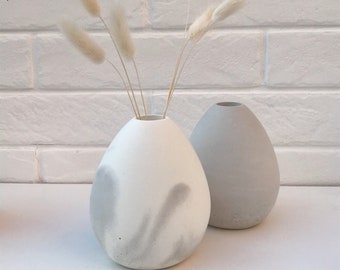 Egg shaped concrete display vase