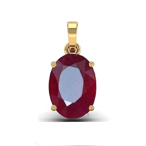 Może przedstawiać: Złoty wisiorek z dużym, owalnym rubinem. Rubin jest ciemnoczerwony i ma szlif fasetowany.
