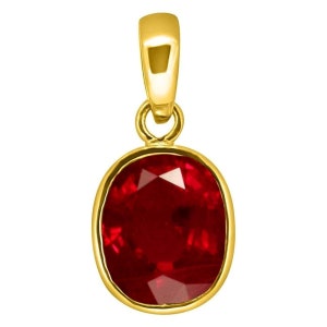 May include: A gold pendant with a red oval gemstone. The pendant is designed to be worn as a necklace.